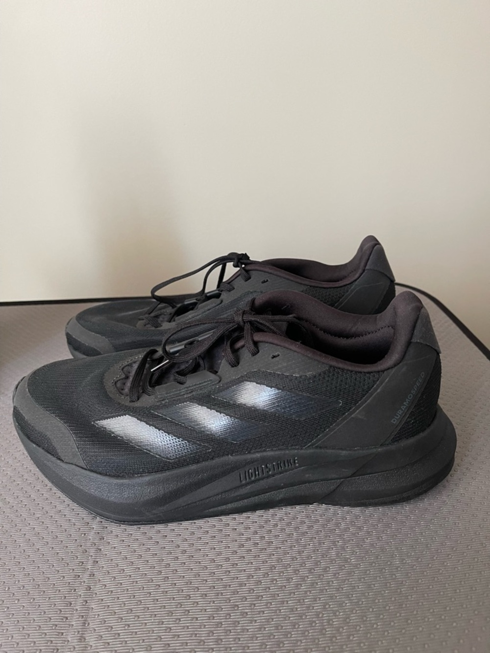 adidas Black Athletic Running Shoes with Subtle Three-Stripes